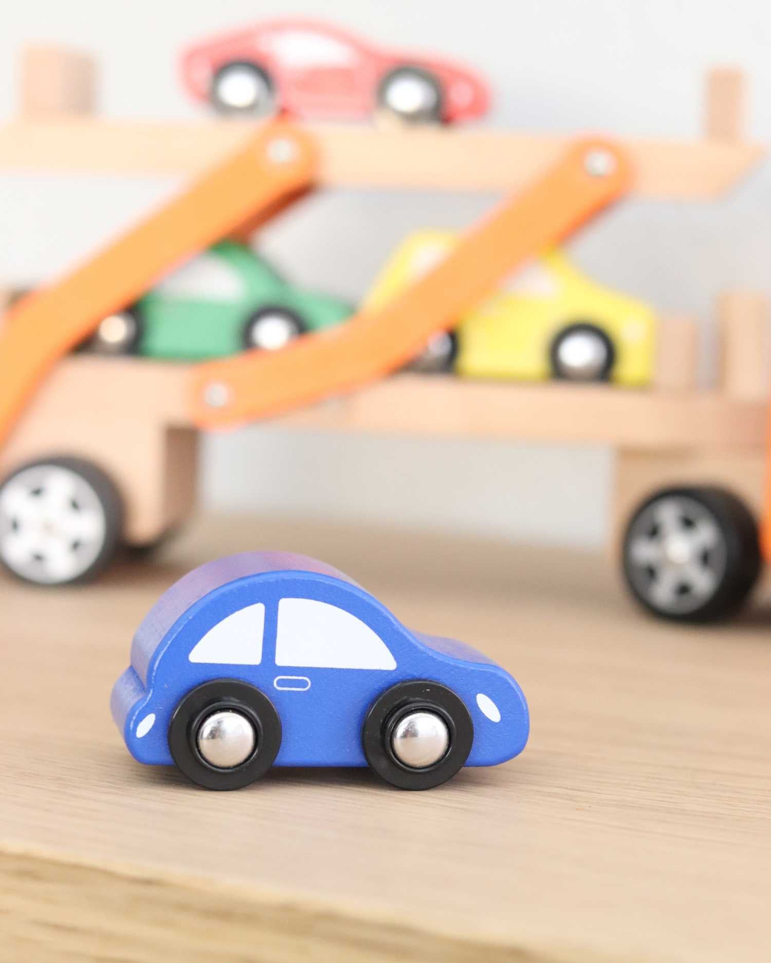 close up view of mini blue car from Wooden Car Carrier playset